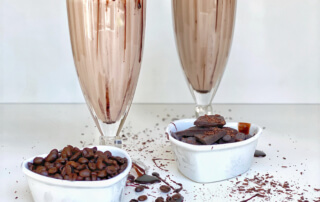 mocha keto chow in a soda glass with a striped straw